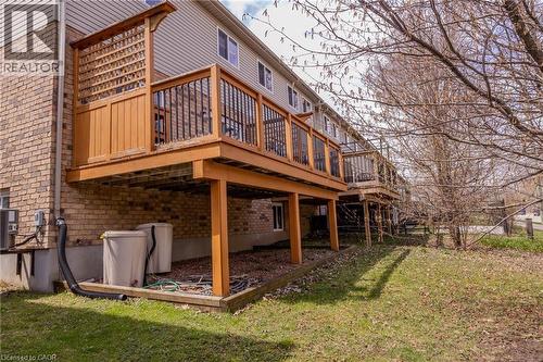 The property features a wood deck with a lattice privacy screen and black metal balusters - 338 Maverick Street, Waterloo, ON - Outdoor With Deck Patio Veranda