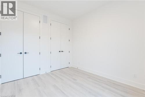 The room features light-colored flooring, white walls, and white doors with dark hardware - 144 Everett Common, St. Catharines, ON - Indoor Photo Showing Other Room