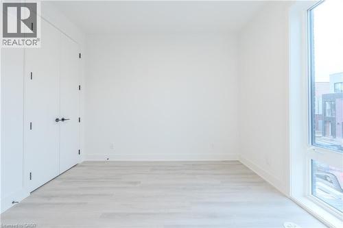 This room features light-toned flooring, white walls, and a window providing natural light - 144 Everett Common, St. Catharines, ON - Indoor Photo Showing Other Room