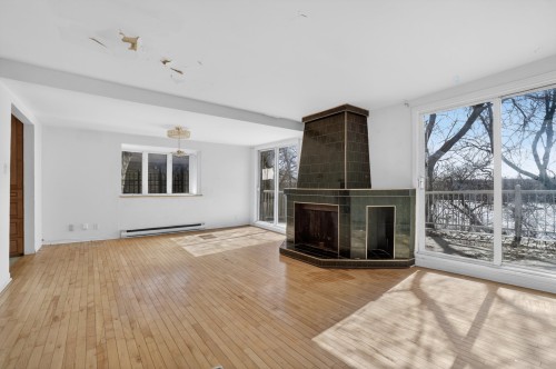 Salon - 3788 Boul. Lévesque E., Laval (Saint-Vincent-De-Paul), QC - Indoor Photo Showing Other Room With Fireplace
