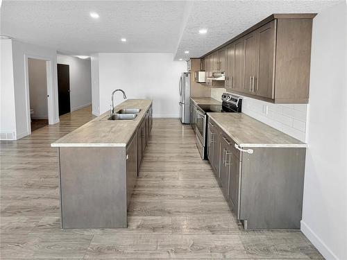57 Cobalt Crescent, Brandon, MB - Indoor Photo Showing Kitchen With Double Sink