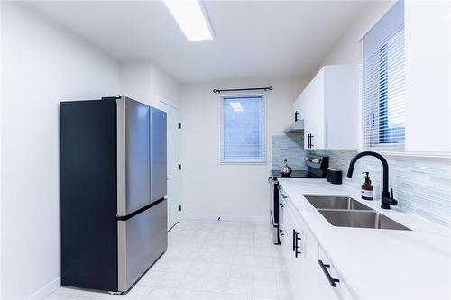 221 Roberta Avenue, Winnipeg, MB - Indoor Photo Showing Kitchen With Double Sink