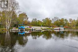 Landing/Parking area with dock and boat ramp - 