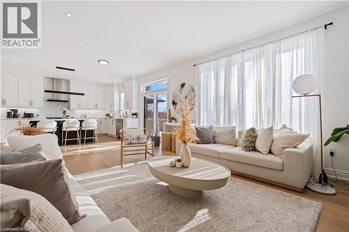 Living room featuring light wood-type flooring and recessed lighting - 66 Cesar Place, Ancaster, ON - Indoor Photo Showing Living Room
