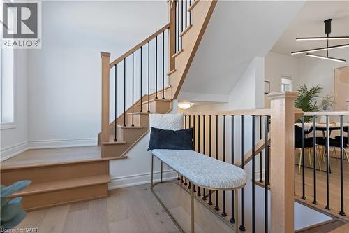 Stairs featuring wood finished floors and a ceiling fan - 66 Cesar Place, Ancaster, ON - Indoor Photo Showing Other Room