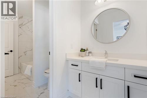 Bathroom with vanity and light marble finish flooring - 66 Cesar Place, Ancaster, ON - Indoor Photo Showing Bathroom