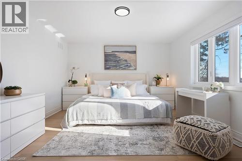 Bedroom featuring light wood finished floors and baseboards - 66 Cesar Place, Ancaster, ON - Indoor Photo Showing Bedroom