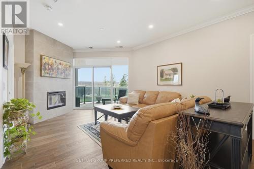 401 - 1200 Commissioners Road W, London South (South B), ON - Indoor Photo Showing Living Room With Fireplace