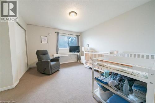 Room featuring neutral carpeting, white walls, and a ceiling-mounted light fixture - 391 Pioneer Drive Unit# 4, Kitchener, ON - Indoor