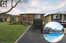 This property features a well-maintained front lawn, an attached garage, and a paved driveway leading to stone steps - 364 Roselawn Place, Waterloo, ON  - Outdoor With Facade 