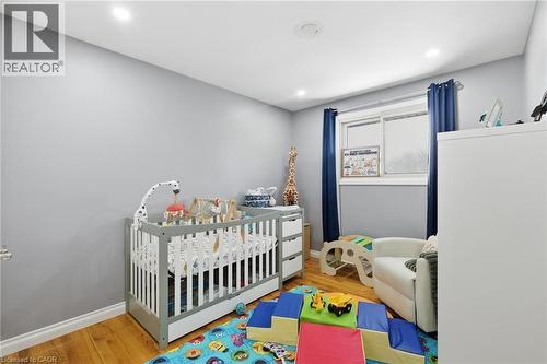 Bedroom featuring a nursery area and light wood-type flooring - 364 Roselawn Place, Waterloo, ON - Indoor Photo Showing Other Room