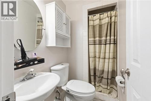 Bathroom with a shower with shower curtain and a sink - 364 Roselawn Place, Waterloo, ON - Indoor Photo Showing Bathroom