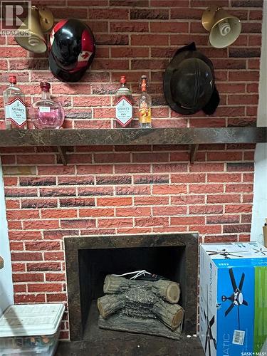 321 3Rd Street, Frobisher, SK - Indoor Photo Showing Living Room With Fireplace