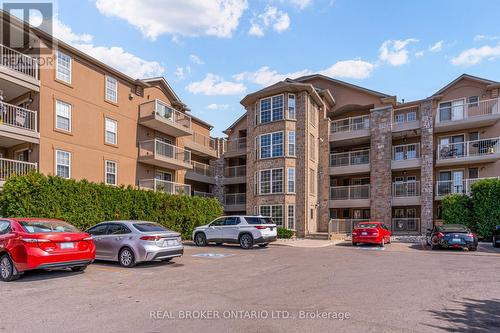 313 - 1460 Bishops Gate, Oakville, ON - Outdoor With Balcony With Facade