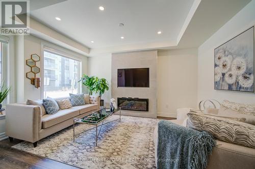 31 - 3023 Creekshore Common, Oakville, ON - Indoor Photo Showing Living Room With Fireplace