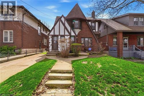 Tudor-style exterior with brick and timber-frame detailing - 509 Aberdeen Avenue, Hamilton, ON - Outdoor With Deck Patio Veranda