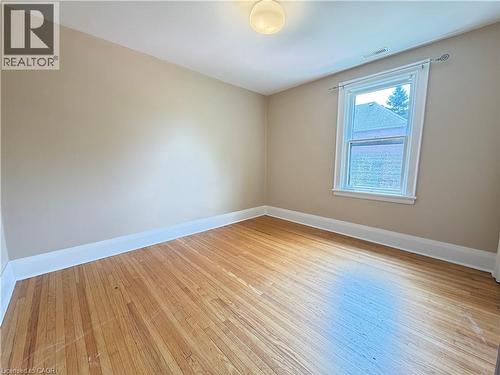 Room featuring wood-finish flooring, neutral wall tones, and white trim - 509 Aberdeen Avenue, Hamilton, ON - Indoor Photo Showing Other Room