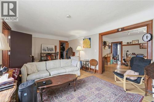 Hardwood flooring throughout, framed by light-toned walls and crisp white trim - 509 Aberdeen Avenue, Hamilton, ON - Indoor Photo Showing Living Room