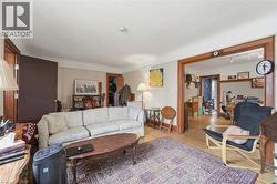 Hardwood flooring throughout, framed by light-toned walls and crisp white trim - 