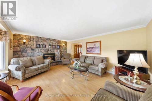 Spacious Living Room with Hardwood Floors - 756 Champlain Road, Tiny, ON - Indoor Photo Showing Living Room With Fireplace