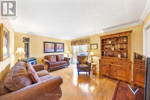 Main Floor Family Room with Walkout to Deck - 756 Champlain Road, Tiny, ON - Indoor Photo Showing Living Room
