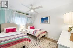 Light wood-finish flooring complements the bright white walls and ceiling - 