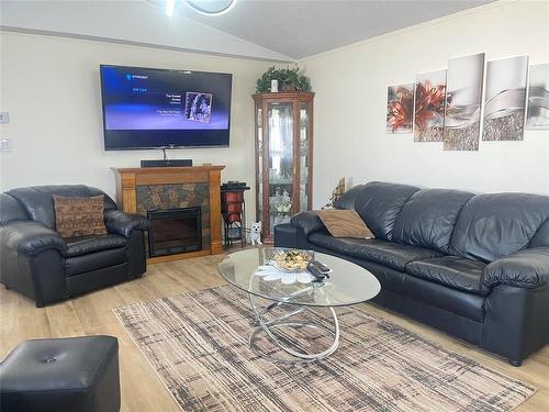 37 Bluebird Crescent, Brandon, MB - Indoor Photo Showing Living Room With Fireplace