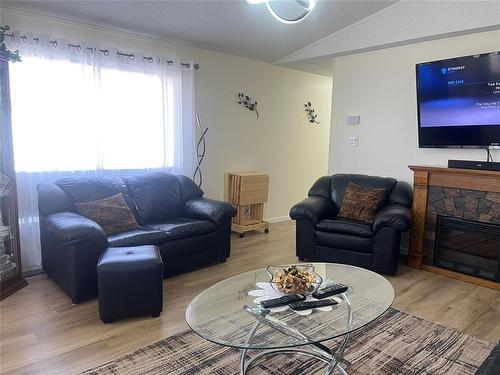 37 Bluebird Crescent, Brandon, MB - Indoor Photo Showing Living Room With Fireplace
