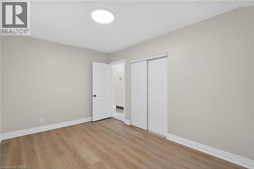 Neutral wall paint with white trim - 53 Nicklin Crescent, Guelph, ON - Indoor Photo Showing Other Room