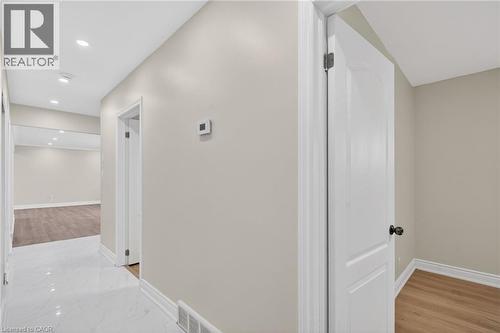 Hallway with recessed lighting, white baseboards, and light neutral wall paint - 53 Nicklin Crescent, Guelph, ON - Indoor Photo Showing Other Room