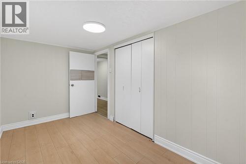 Room with wood-finish flooring, light grey walls, and white trim - 53 Nicklin Crescent, Guelph, ON - Indoor Photo Showing Other Room