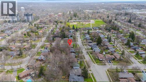 Aerial perspective showcasing a residential neighborhood with established trees, paved streets, and a mix of single-story and multi-story homes - 53 Nicklin Crescent, Guelph, ON - Outdoor With View