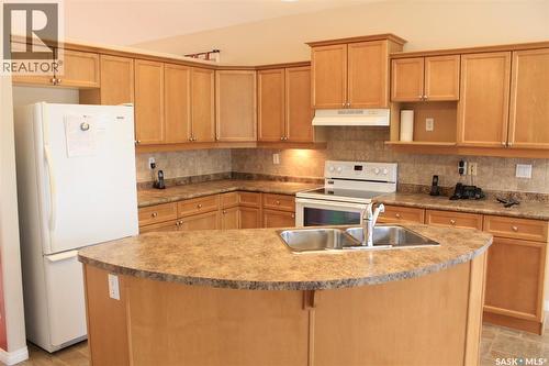 218 802 Heritage Crescent, Saskatoon, SK - Indoor Photo Showing Kitchen With Double Sink