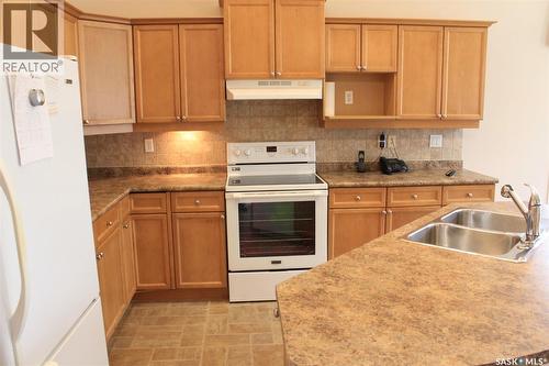 218 802 Heritage Crescent, Saskatoon, SK - Indoor Photo Showing Kitchen With Double Sink