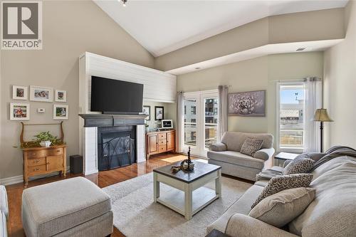 1550 Venetian Boulevard Unit# 310, Point Edward, ON - Indoor Photo Showing Living Room With Fireplace