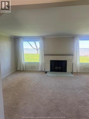 11506 Riverside, Windsor, ON - Indoor Photo Showing Living Room With Fireplace