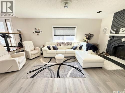 787 Brimacombe Drive, Weyburn, SK - Indoor Photo Showing Living Room With Fireplace