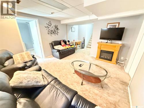 787 Brimacombe Drive, Weyburn, SK - Indoor Photo Showing Living Room With Fireplace