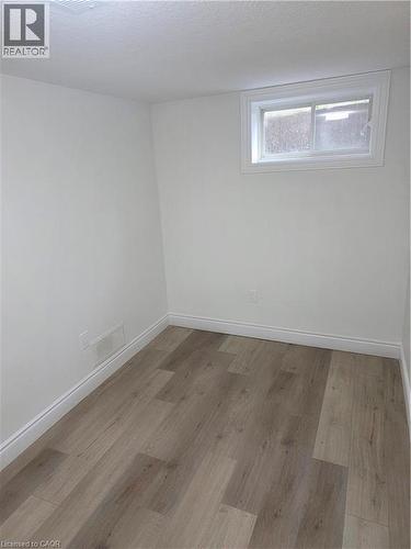 Room featuring wood-finish flooring - 22 Montrose Avenue, Kitchener, ON - Indoor Photo Showing Other Room