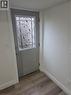 Entry door featuring decorative wrought iron scrollwork over frosted glass - 22 Montrose Avenue, Kitchener, ON  - Indoor Photo Showing Other Room 