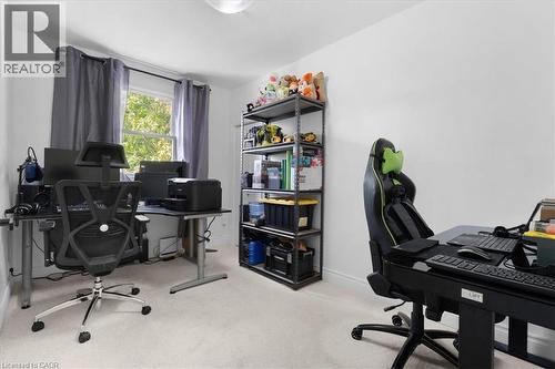 Room featuring light-toned carpeting, white wall finishes, and a single window with dark drapery - 133 Frederick Avenue, Hamilton, ON - Indoor Photo Showing Office