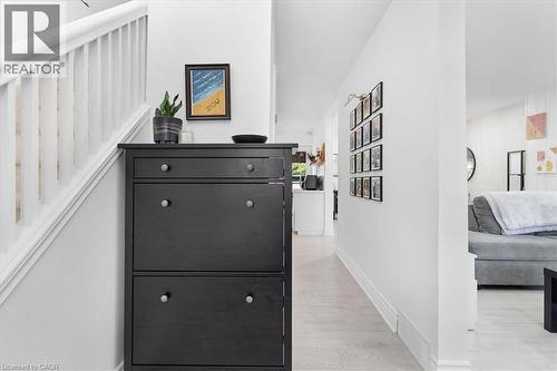Light-toned wood-finish flooring provides a neutral base for the space - 133 Frederick Avenue, Hamilton, ON - Indoor