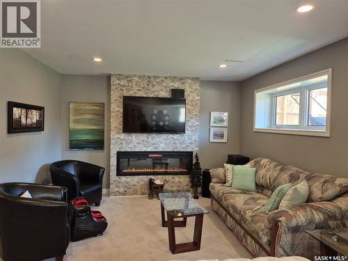 816 Battleford Trail, Swift Current, SK - Indoor Photo Showing Living Room With Fireplace