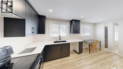 1511 8Th Avenue N, Regina, SK - Indoor Photo Showing Kitchen With Double Sink