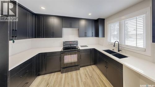 1511 8Th Avenue N, Regina, SK - Indoor Photo Showing Kitchen With Double Sink