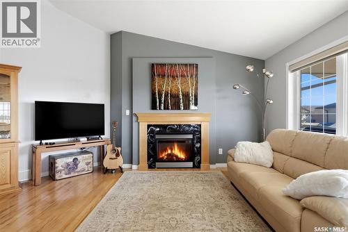 5 Corbin Bay, Grand Coulee, SK - Indoor Photo Showing Living Room With Fireplace