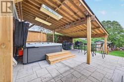 Covered Hot Tub 2024 on new stamped concrete patio - 