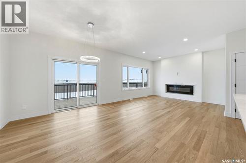 335 Sharma Crescent, Saskatoon, SK - Indoor Photo Showing Living Room With Fireplace