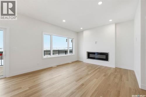 335 Sharma Crescent, Saskatoon, SK - Indoor Photo Showing Living Room With Fireplace