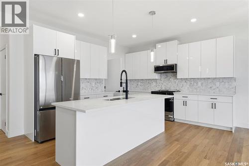 335 Sharma Crescent, Saskatoon, SK - Indoor Photo Showing Kitchen With Double Sink With Upgraded Kitchen